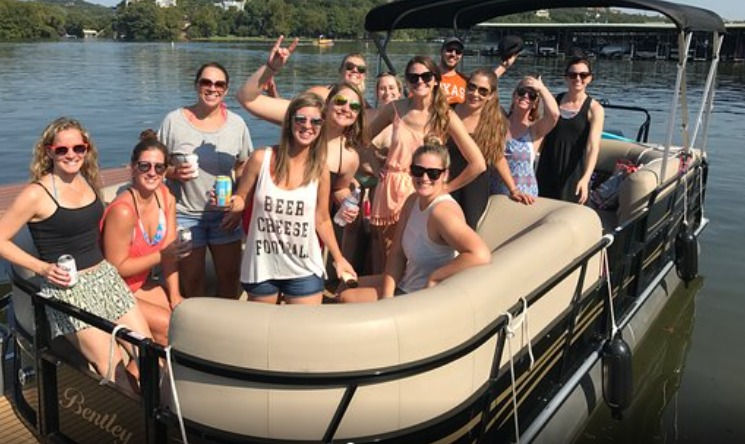 a group of people in a boat on a body of water