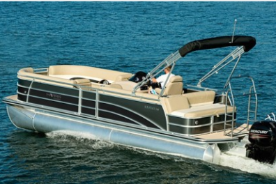 Pontoon boat with a canopy cruising on a lake.