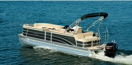 Pontoon boat with a canopy cruising on a lake.